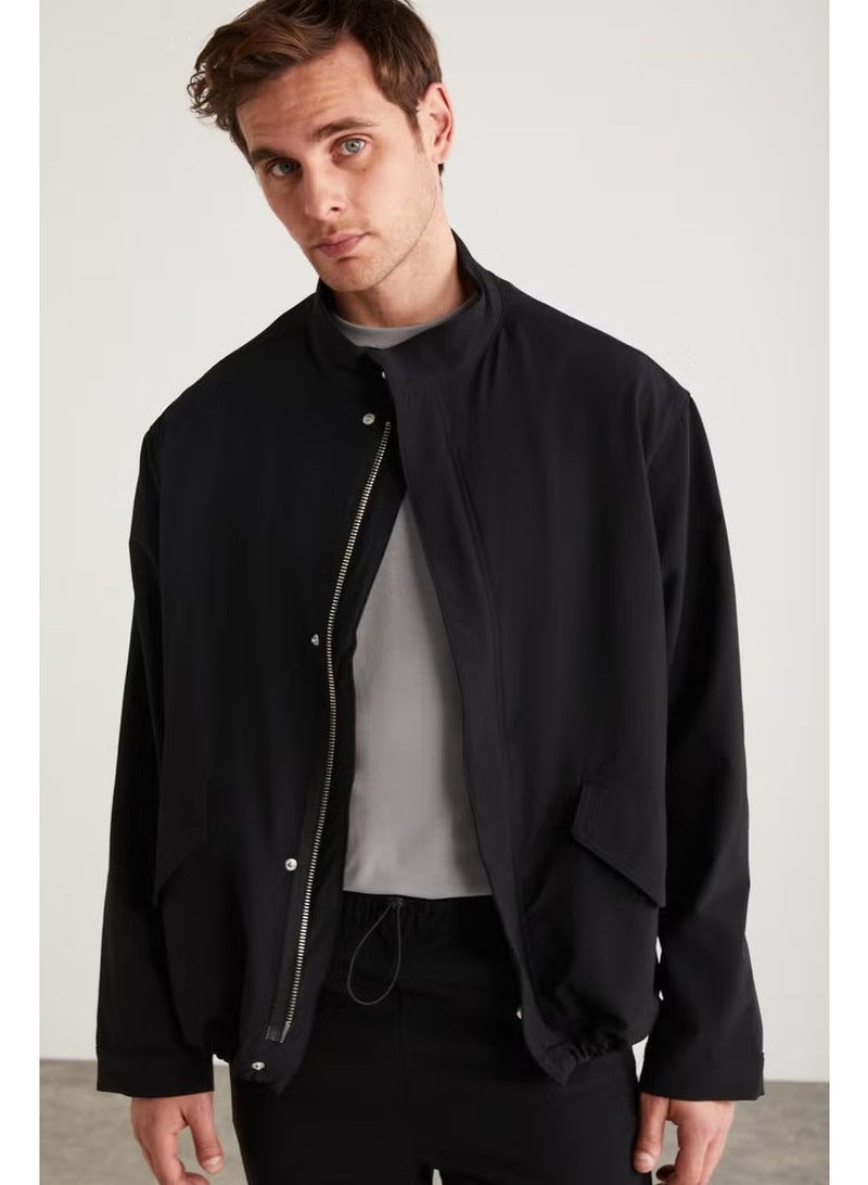GRIMELANGE Roger Men's Stretchy Technical Fabric Thick Zippered Lined Sleeve Cuffed Flap Pocket Black Jacket - Image 1
